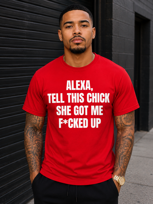 Man wearing a red t-shirt with white text that says Alexa, tell this chick she got me fucked up. He is standing against a black background for dating is trash