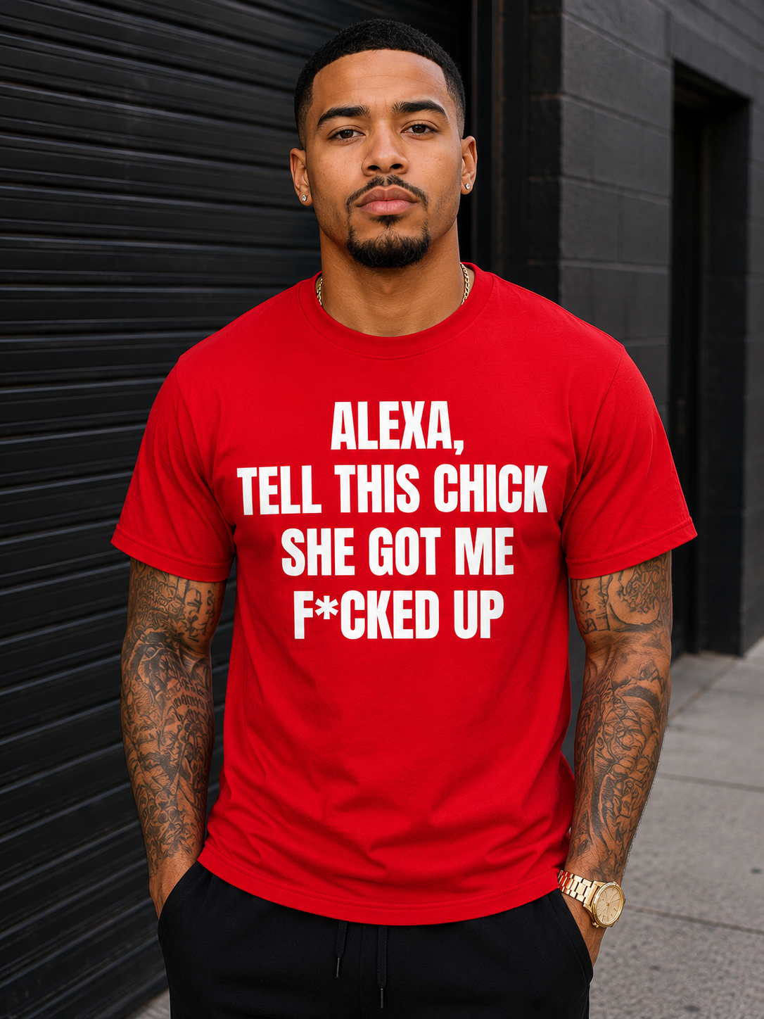 Man wearing a red t-shirt with white text that says Alexa, tell this chick she got me fucked up. He is standing against a black background for dating is trash